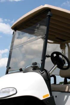E-Z-GO 4-Caddy clear folding windshield for golf carts, providing protection and visibility.