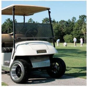 EZGO TXT golf cart featuring a red tinted impact-resistant folding windshield for added protection.