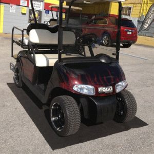 Golf cart parked on garage parking mat for easy access and protection.