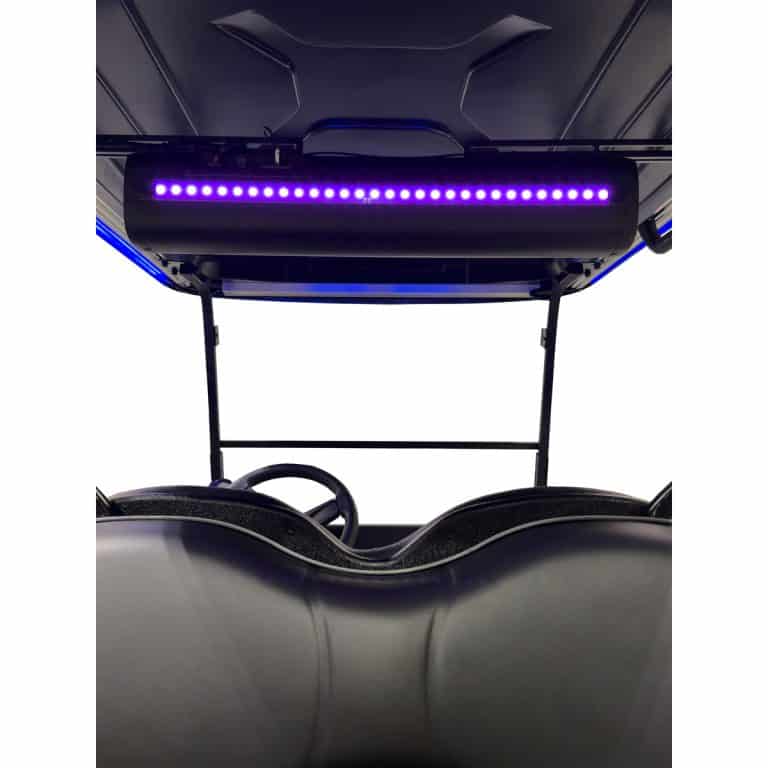 Golf cart interior with purple LED light bar