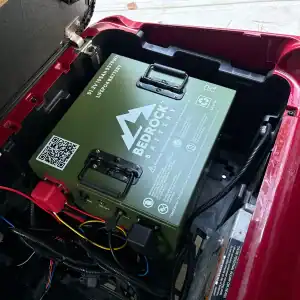 LiFePO4 battery installed inside red vehicle compartment