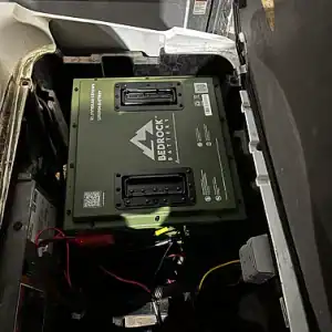 Bedrock Batteries unit installed inside vehicle compartment