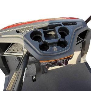 Golf cart dashboard featuring cup holders and control panel for easy access.